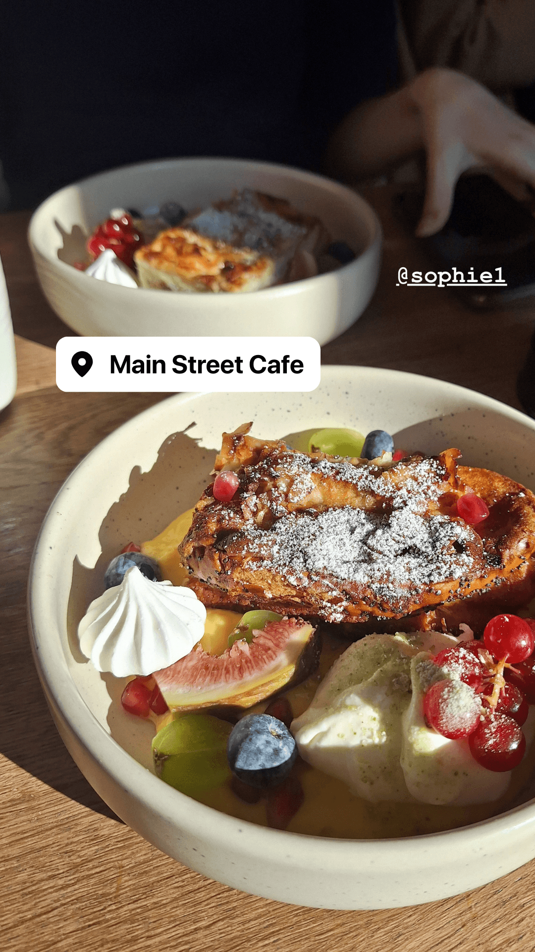 French toast with fresh berries, figs, and whipped cream at Main Street Cafe