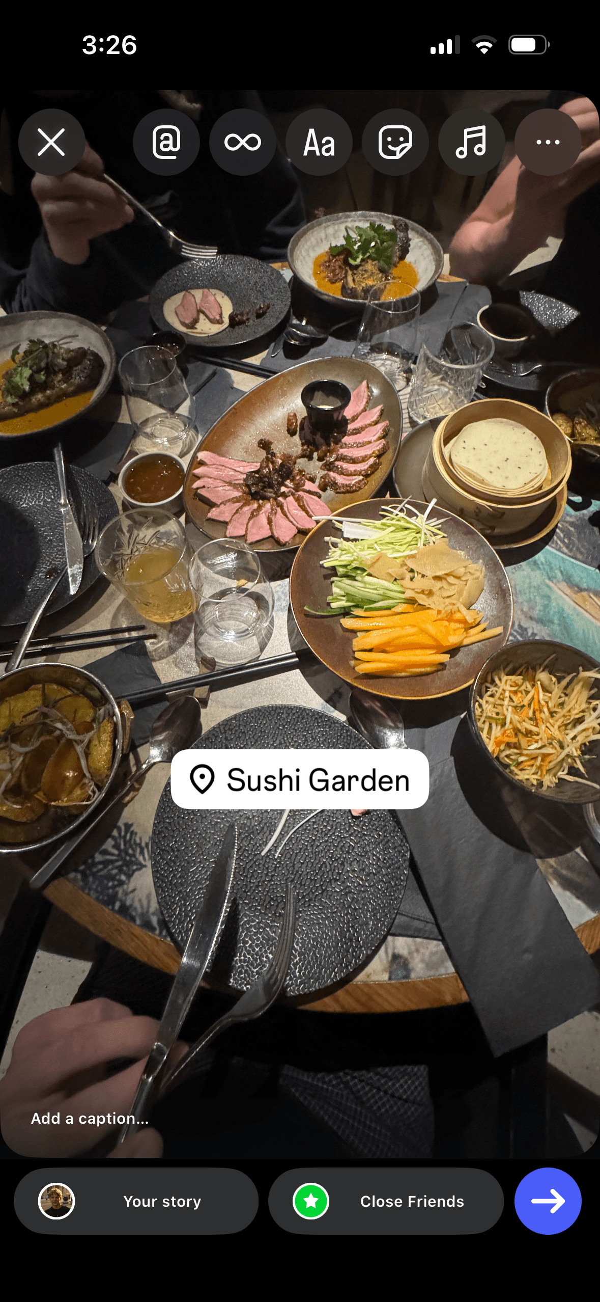 Instagram Story of a dinner table at Sushi Garden with a location tag, ready to be shared