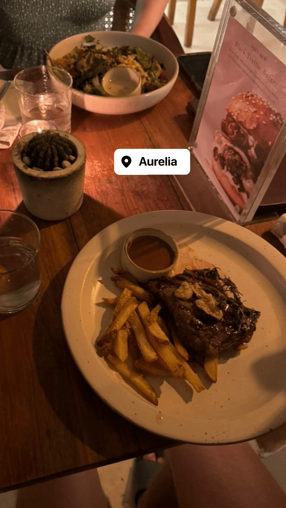 Steak and fries with a side salad at Aurelia restaurant