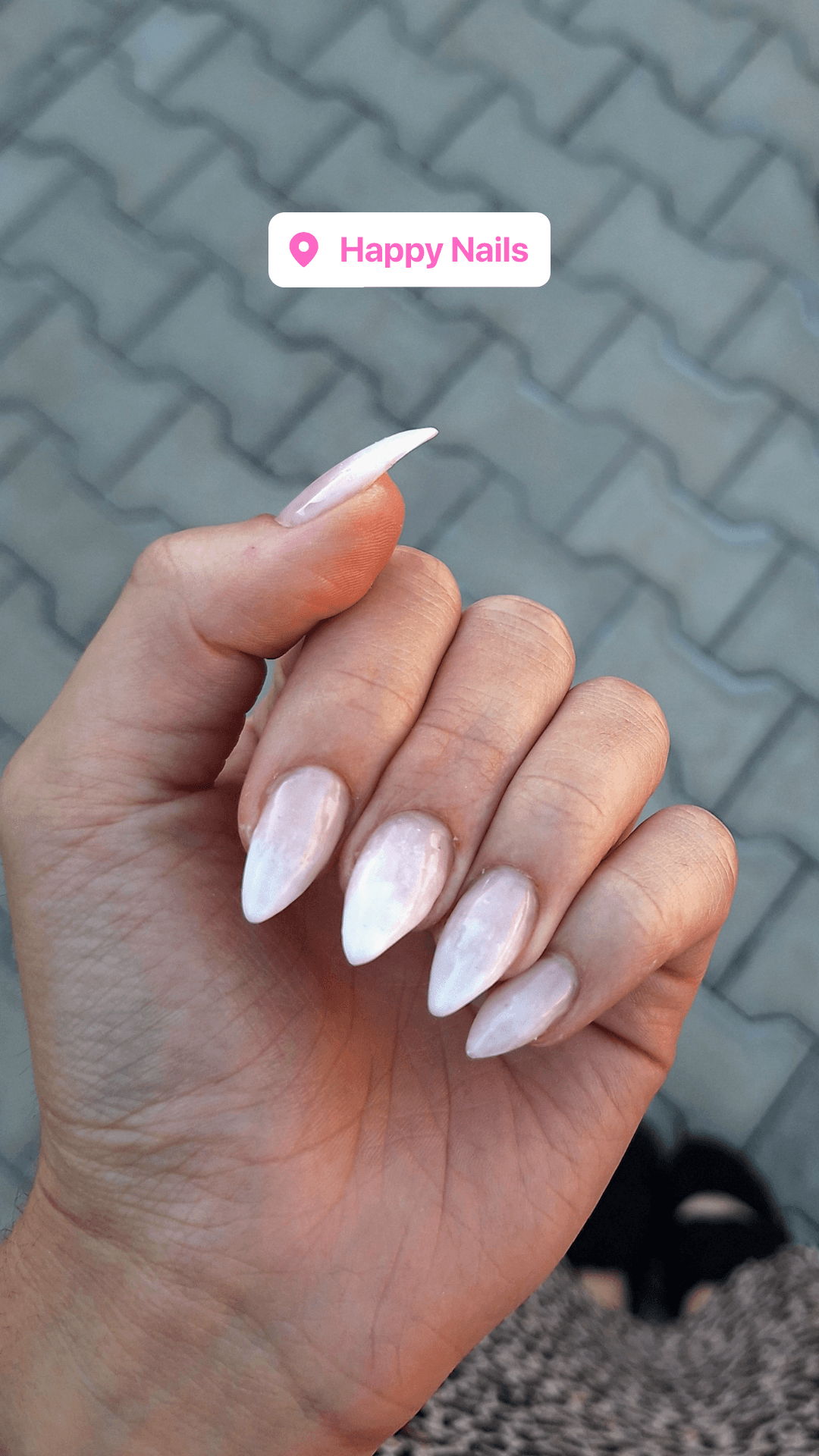 Almond-shaped marble nail set posted by a client at Happy Nails